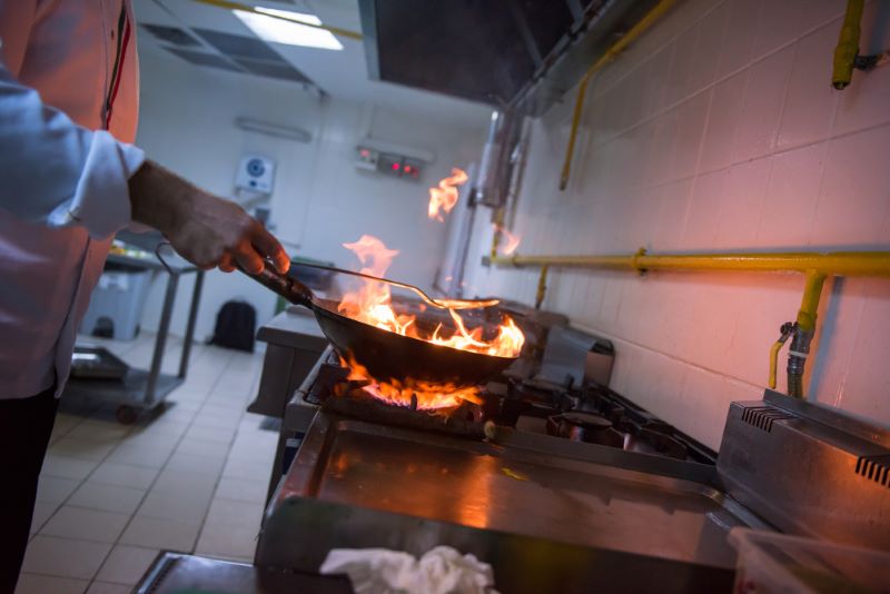 chef cooking with fire