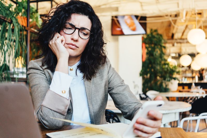 woman confused about insurance claim denial on phone