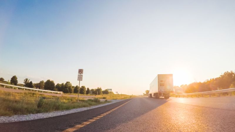Semi truck driving down the highway